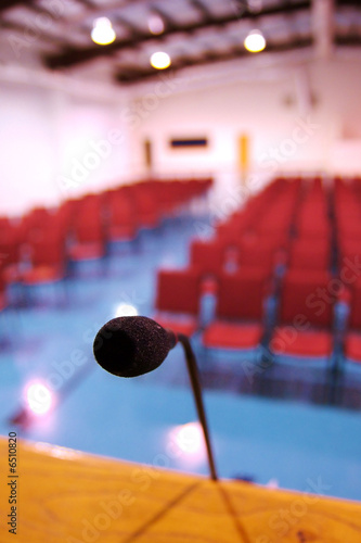 Photo: A microphone in an empty auditorium A microphone in an empty auditorium