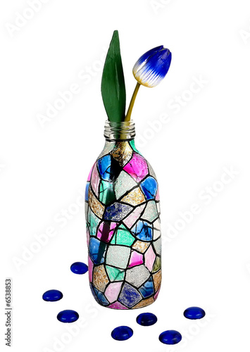 Photo: Stain glass bottle with tulip isolated on white background Stain glass bottle with tulip isolated on white background