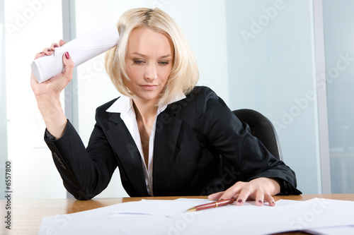 Young  beautiful business woman thinking