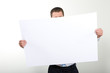 businessman holding a blank paper