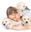 Cute puppies and young girl hugging