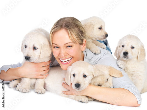 Photo: Cute puppies and young woman Cute puppies and young woman