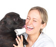 Young woman and sweet puppy playing around