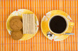 Waffle slice and cup with cofee on bamboo table-cloth