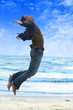 man flying on the beach