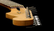 close-up of a vintage guitar neck and strings