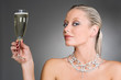 Wealthy woman holding a glass of champagne
