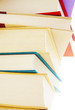 Stack of hard cover books on white background