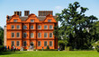 Old red brick English mansion.