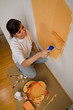 Woman colours her first flat
