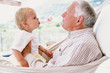 Grandad with grandson in a hammock