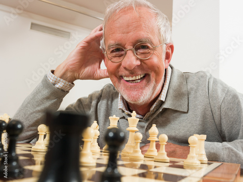 Senior man playing chess