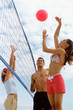 Volleyball game on beach