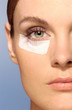 Woman wearing an adhesive plaster on face