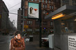 Woman on street with billboard Woman on street with billboard