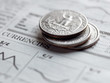 Quarters on a newspaper
