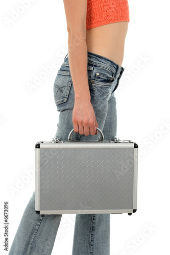 Young woman with metal suitcase