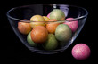 Colorful Candy Balls in Dish, Black Background Colorful Candy Balls in Dish, Black Background