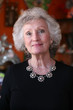 Mature woman with grey hair and beautiful silver jewelry