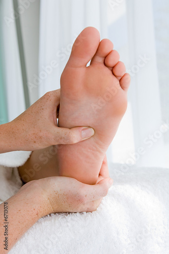 woman having her foot massaged