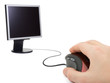 Hand with computer mouse and monitor