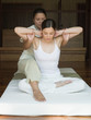Young woman having a thai massage
