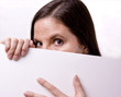 Female Looking Over White Sign Female Looking Over White Sign
