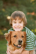 Boy Hugging Golden Retriever Boy Hugging Golden Retriever