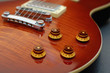 Knob focus on a Les Paul guitar body Knob focus on a Les Paul guitar body
