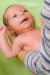 Adorable infant (a boy) in bath - soft focus