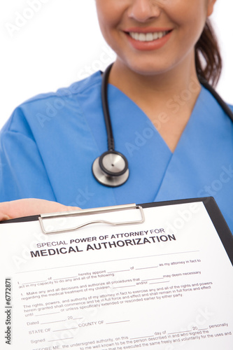 Photo: doctor with form doctor with form