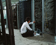 man adjusting electrical cables