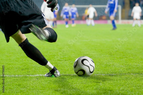 soccer or football goalkeeper kick the ball