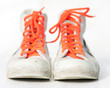 old retro sneakers with orange laces