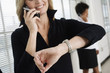 Business women using Cellphones.
