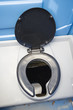 A commode in a camping toilet.