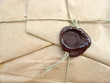 brown packet with sealing wax