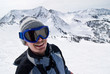Smiling male skier with the Rockies in the background