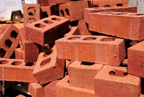 Photo: A stack of bricks at a construction site. A stack of bricks at a construction site.