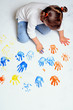 Little girl playing with colors