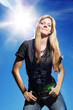 Sexy girl over blue sky with hot sun