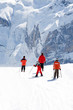 Family on slope. Rocky mountains in background. Family on slope. Rocky mountains in background.