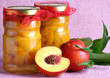 Food,peach compote in two jars and fresh peaches Food,peach compote in two jars and fresh peaches