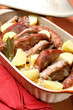 Food,roast meat and sausage with boiled potatoes in clay pot