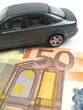 car parked on money