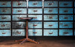 Old stool on drawers background