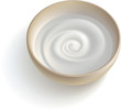 A cup with some white creamy substance.