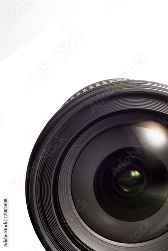 Photo: A camera lens on white isolated background. A camera lens on white isolated background.