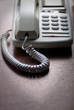 white telephone on wooden desk white telephone on wooden desk