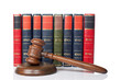 Wooden gavel and old law books Wooden gavel and old law books